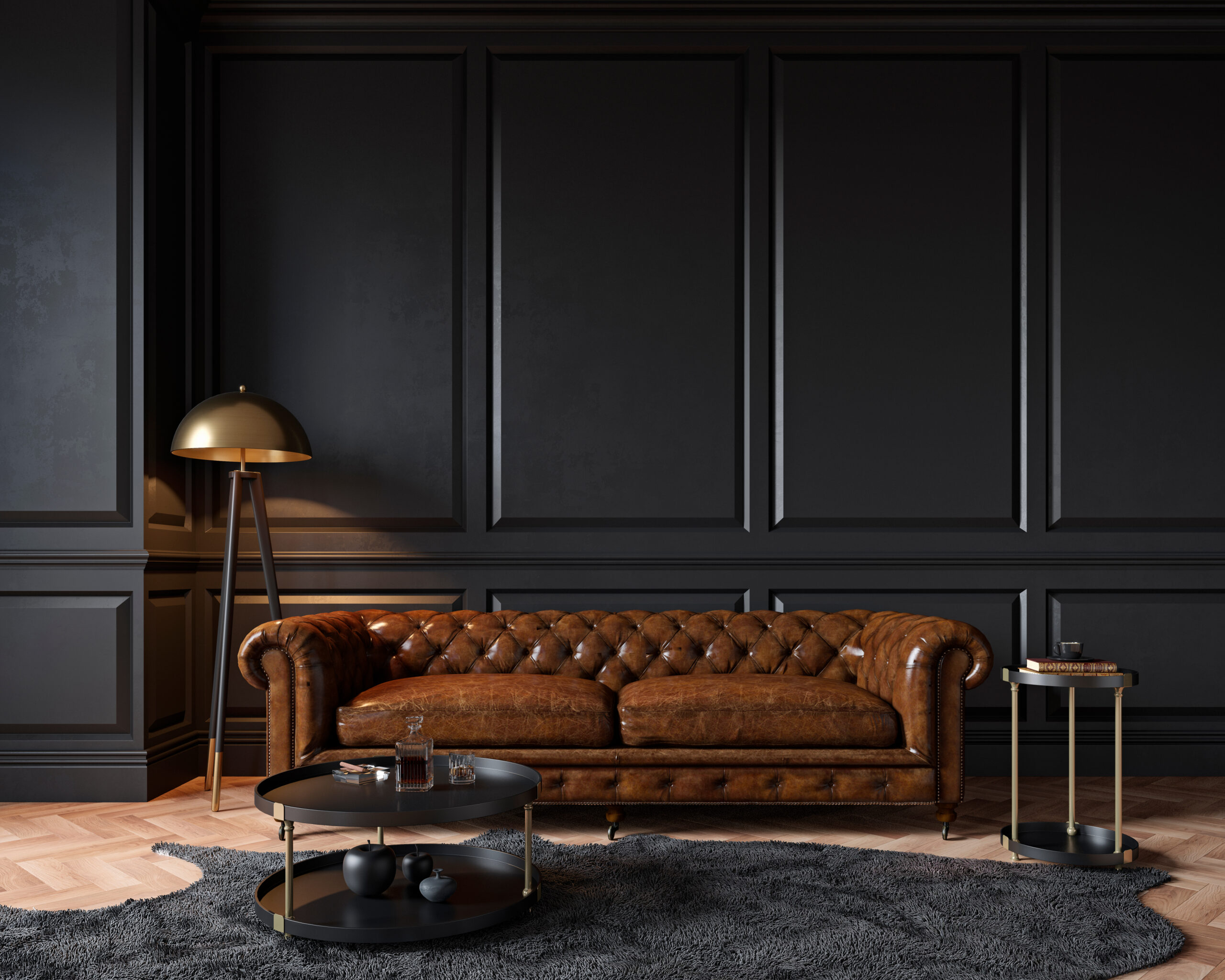 brown leather couch in a dark room