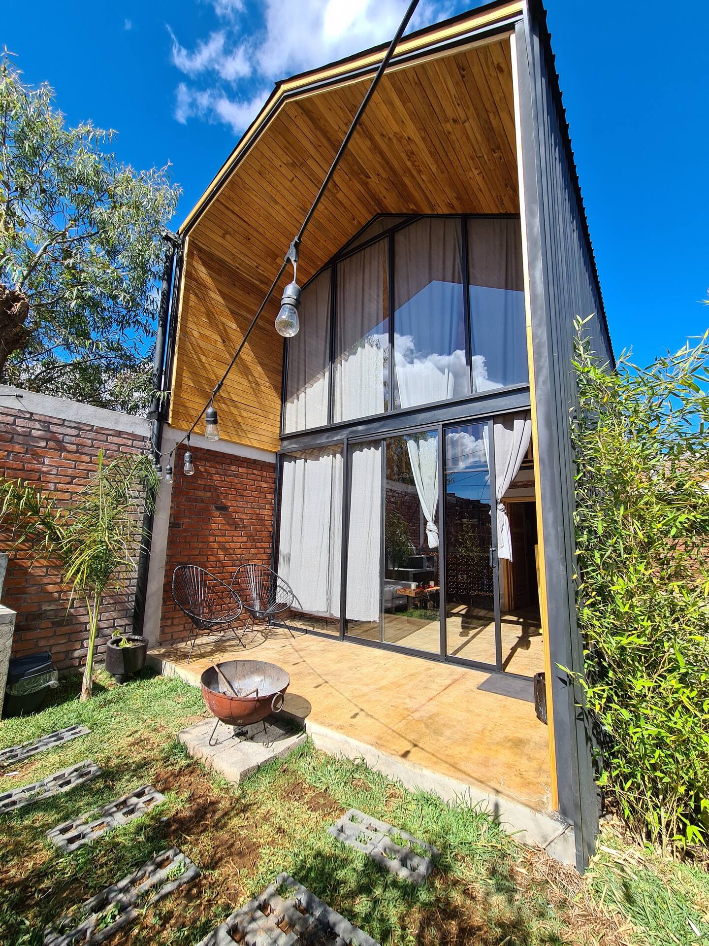 exterior of a tall container with floor to ceiling windows