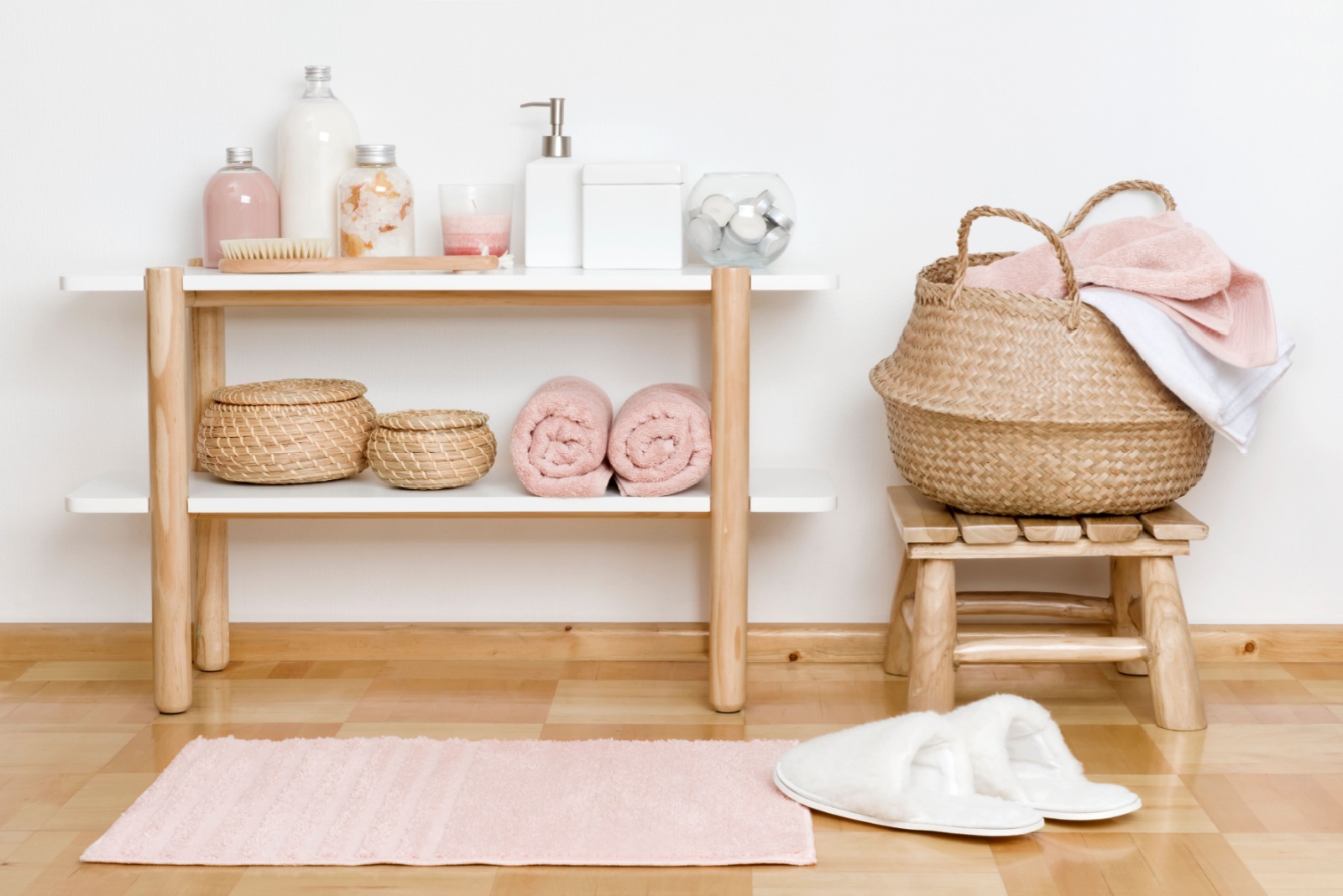 wooden open cabinet and a tiny wooden stool with bathroom essentials