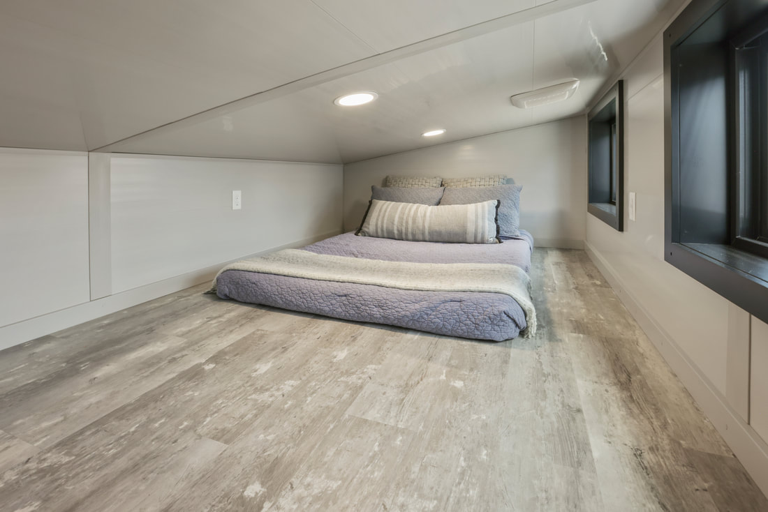 loft bedroom with a bed