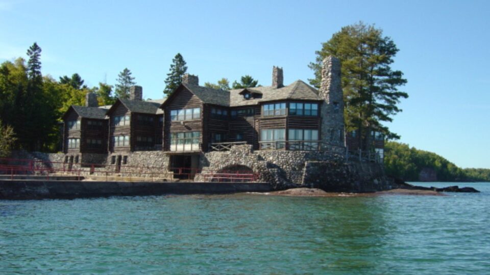 exterior of the biggest log cabin in the world near the lake