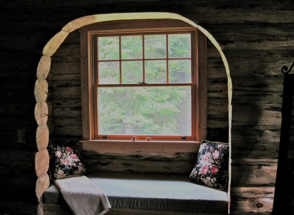 Nook bench by the window with pillows