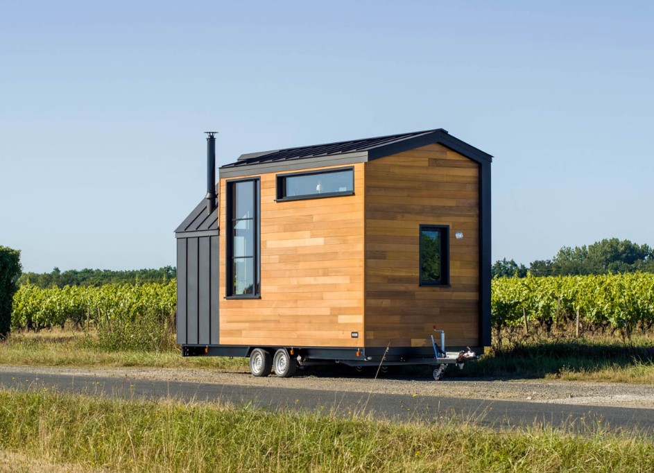 exterior of a tiny home with brown walls and windows