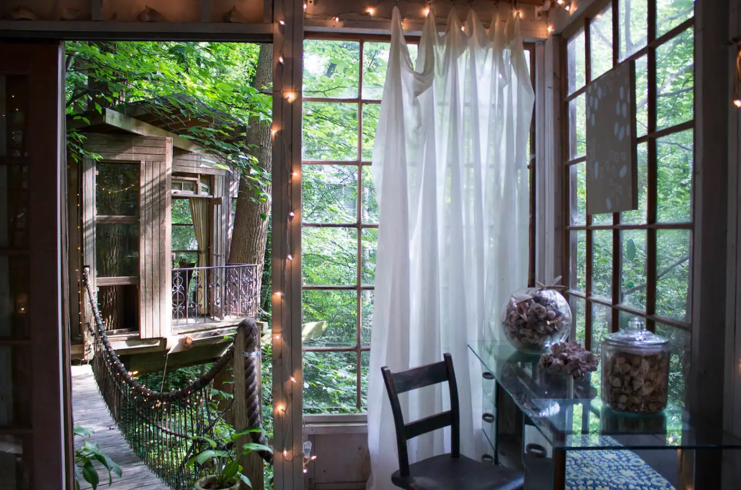 Reading room in treehouse with a glass table