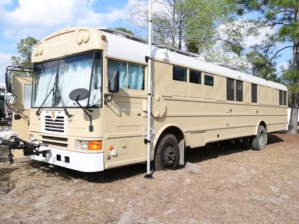 exterior of a beige school bus used as a home