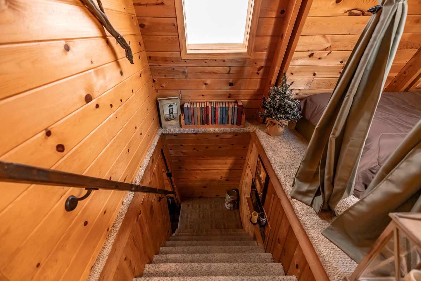 stairs and a mini bookshelf opposite them