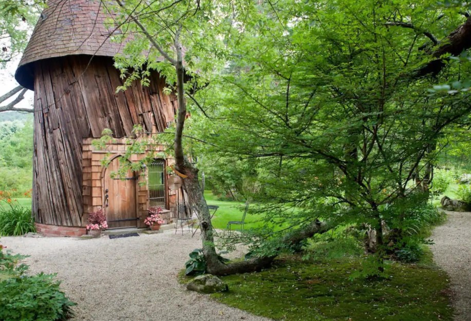 round wooden home in nature