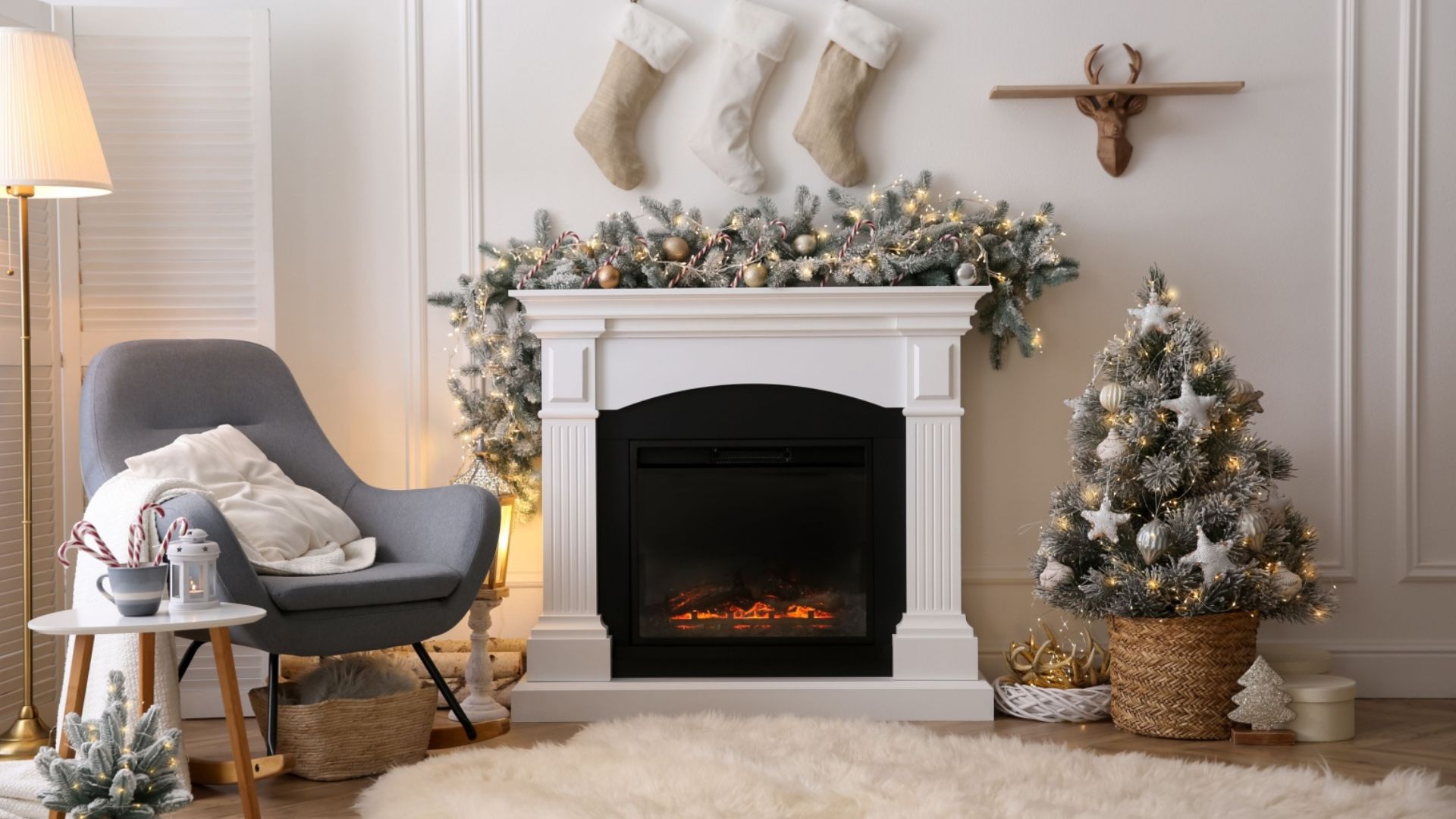 christmas decorations on a mantle and next to the fireplace