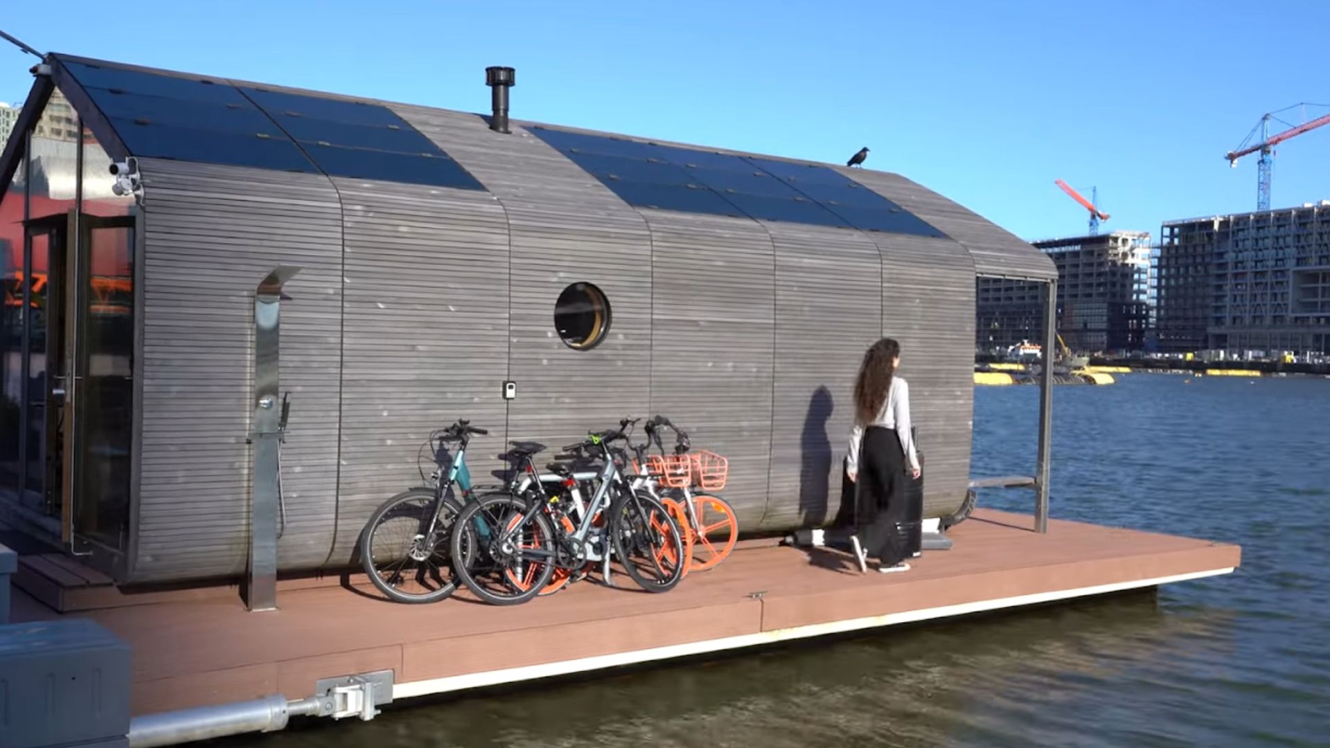 cardboard house with grey exterior floating on water