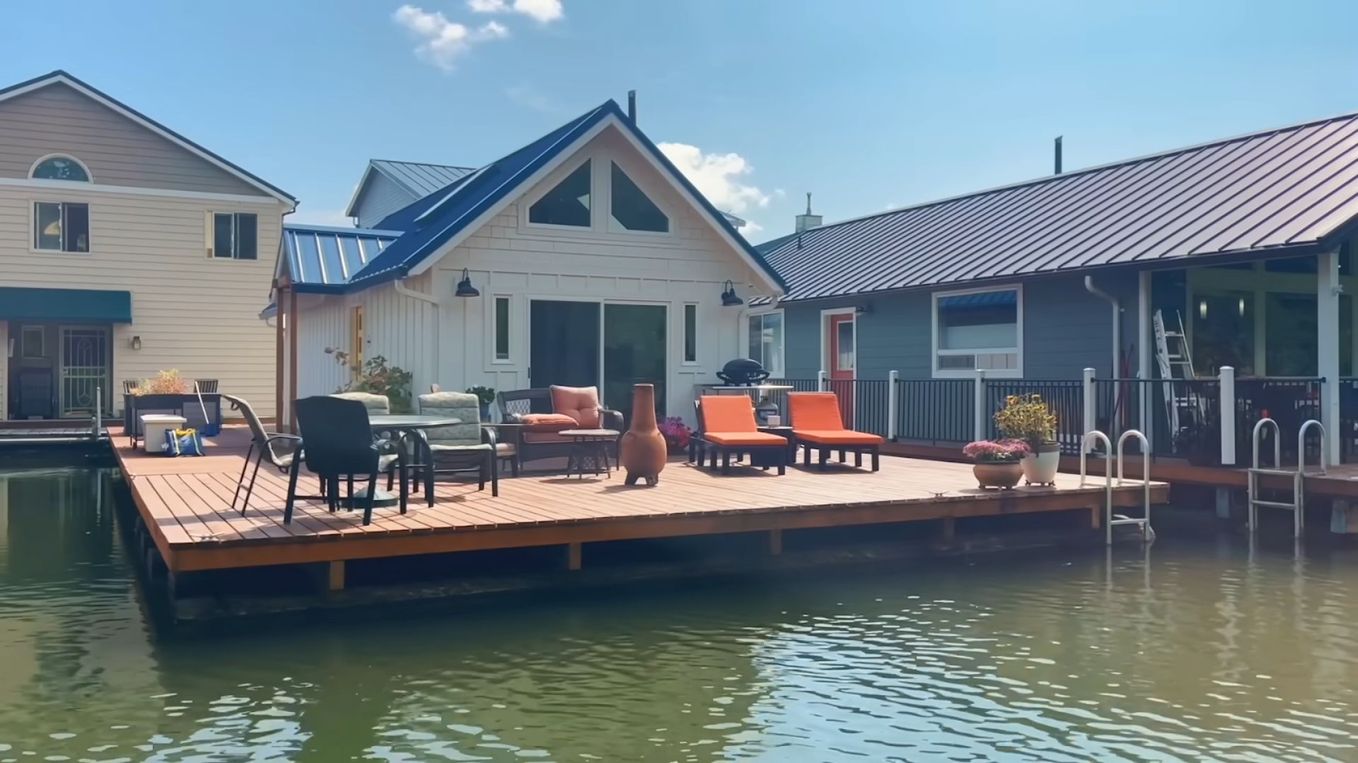 lovely traditional house with a deck floating on water