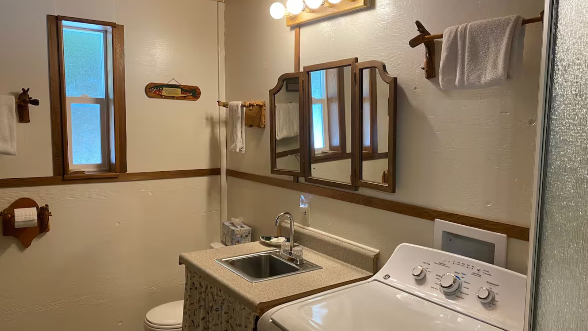 simple bathroom with a pretty mirror