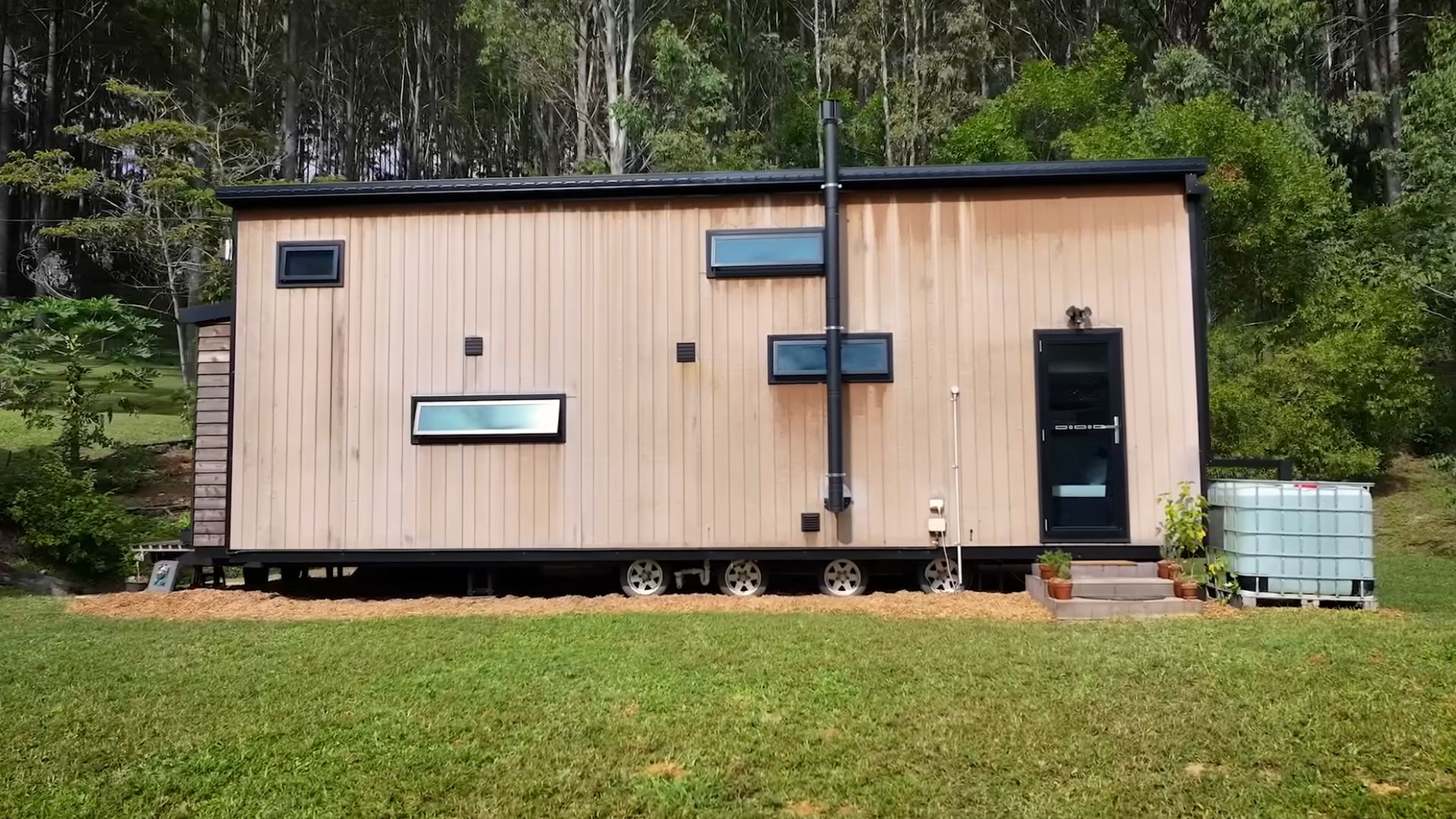 Wooden tiny home in a field