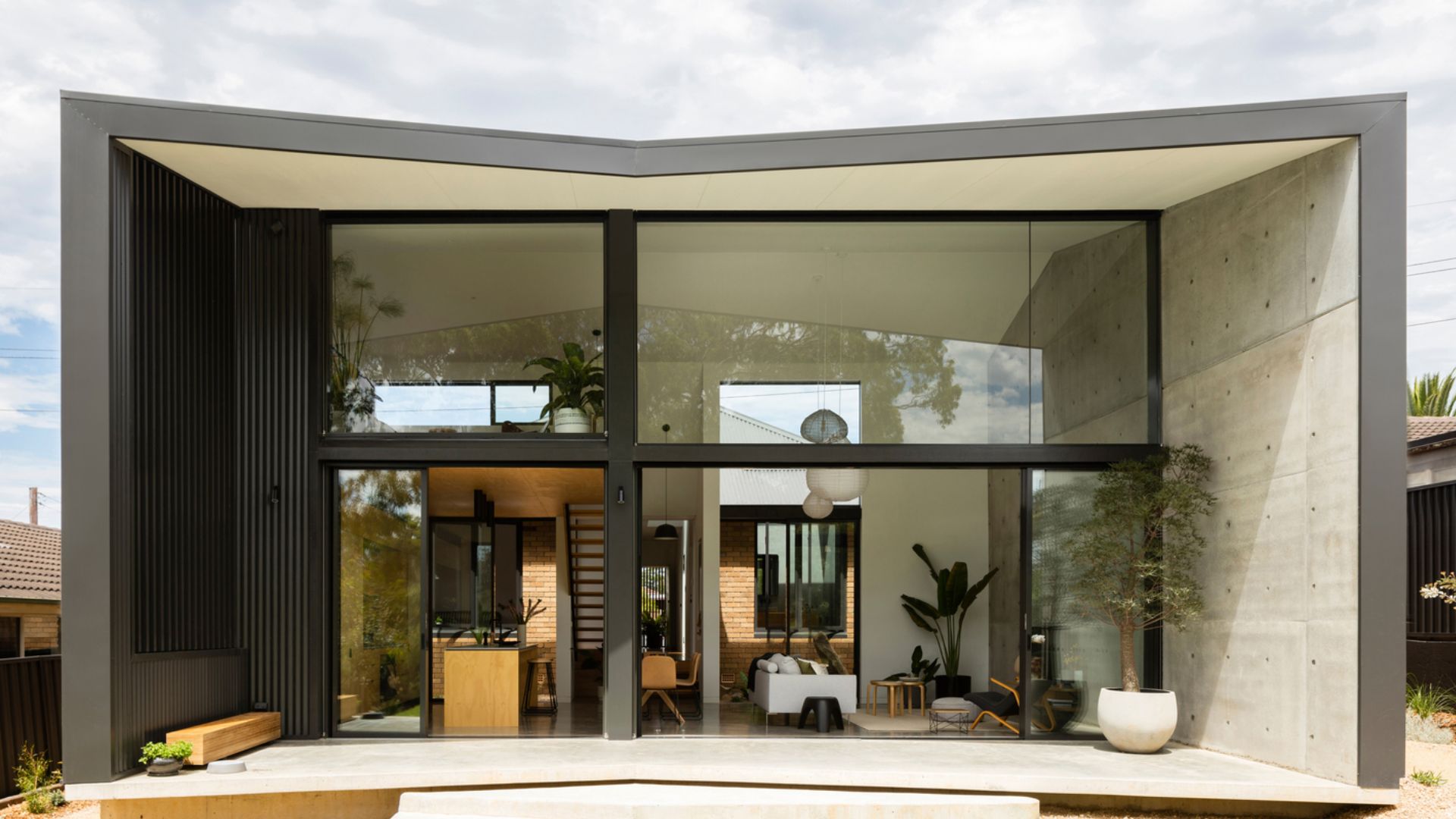 exterior of a modern house with floor to ceiling windows