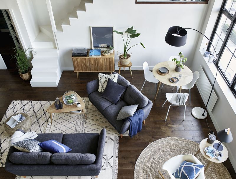 Create Zones with Rugs in a small living room