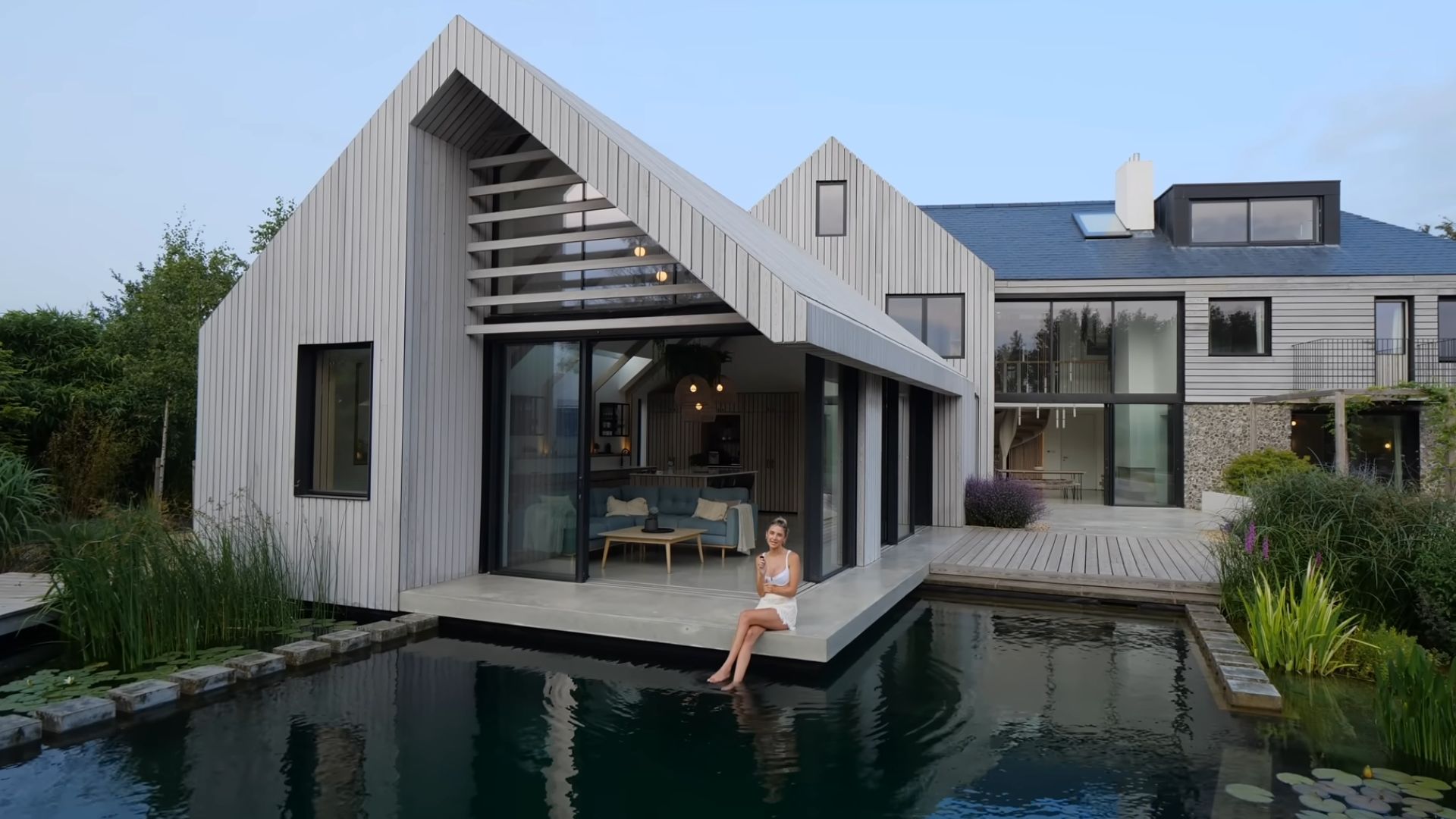 swimming pond next to a house