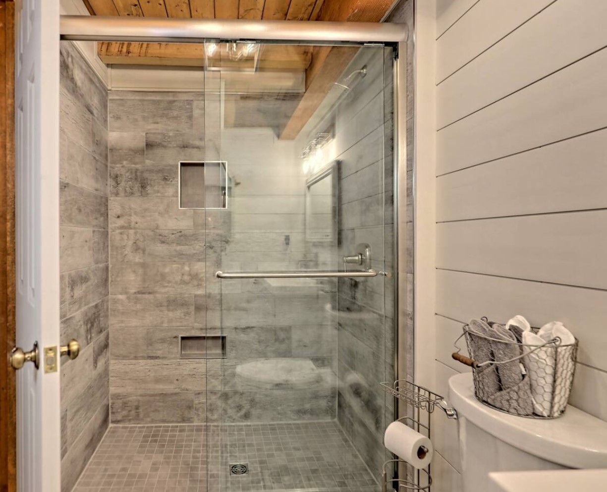 Full gray bathroom with a walk-in shower