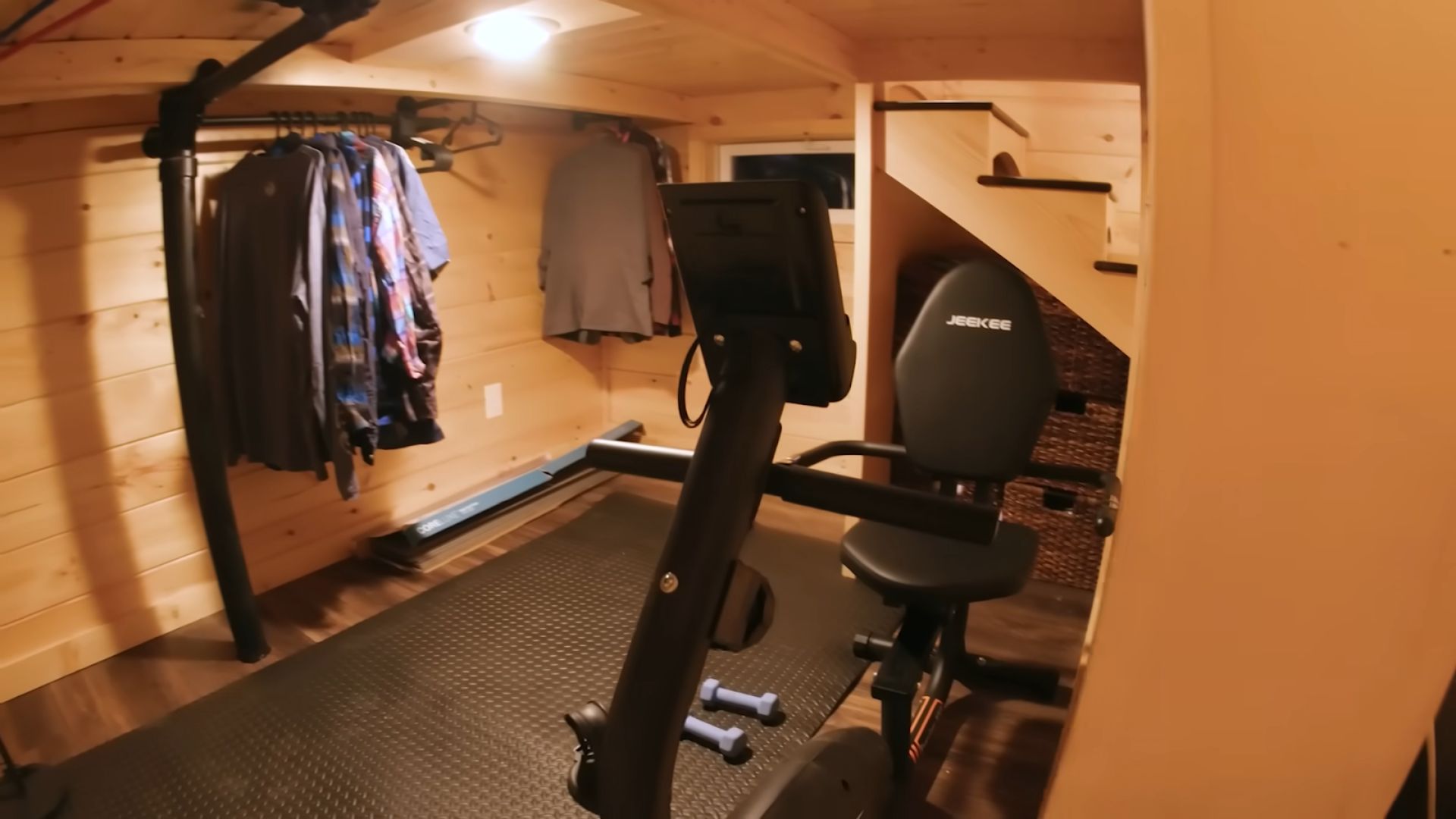 basement in the tiny house with gym equipement