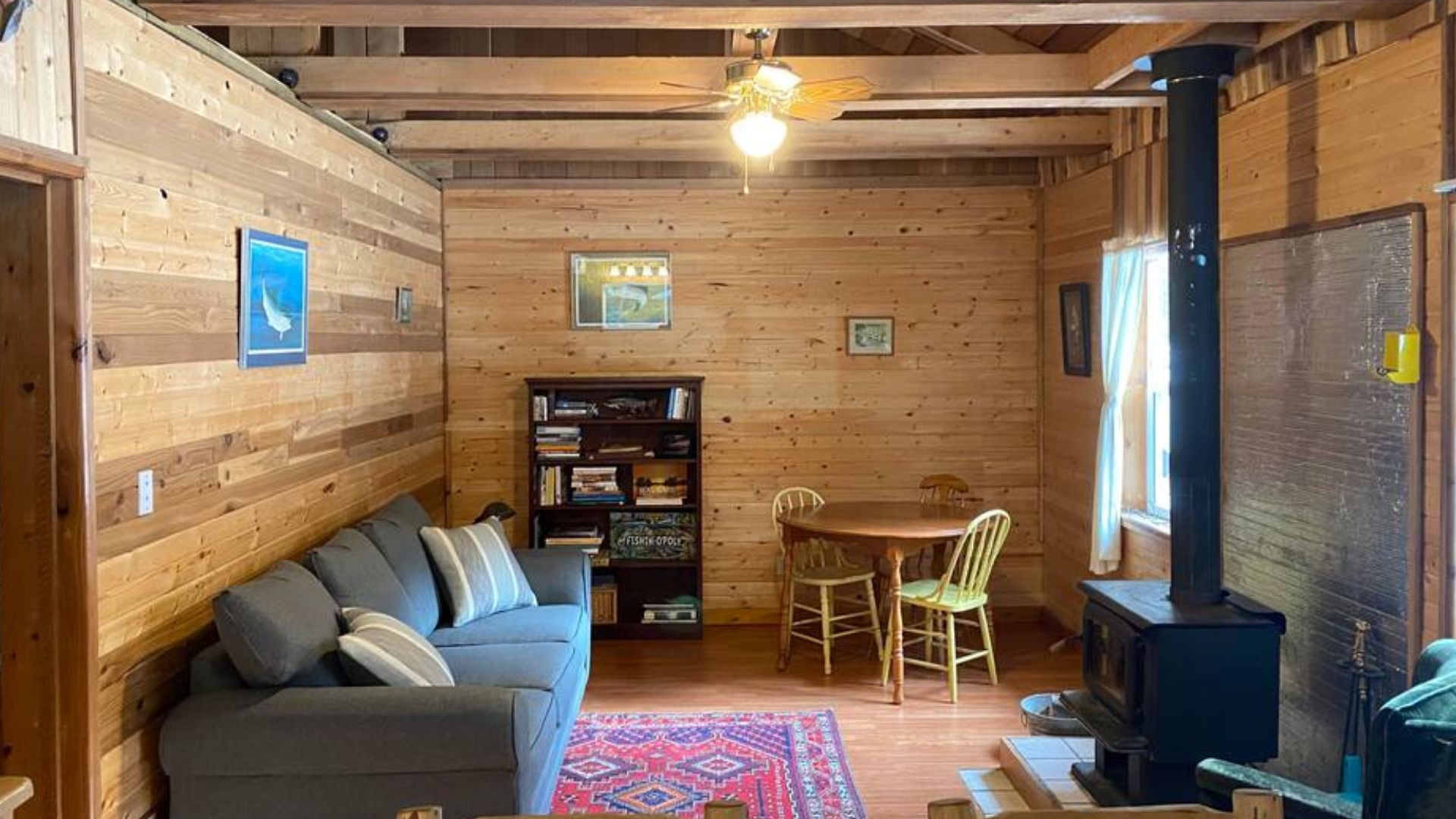 rustic living room with colorful details and a fireplace