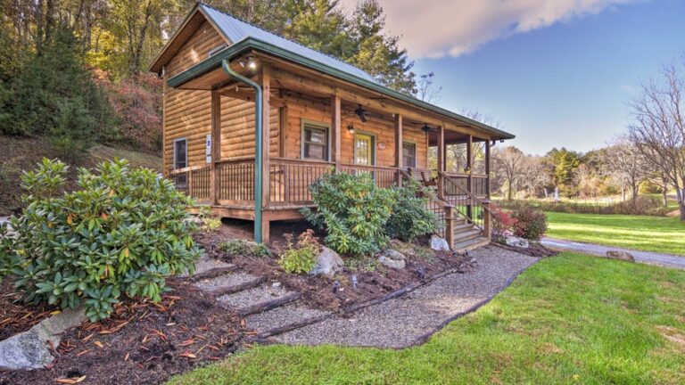 exerior of the brookside cabin with a porch and lots of greenery outside