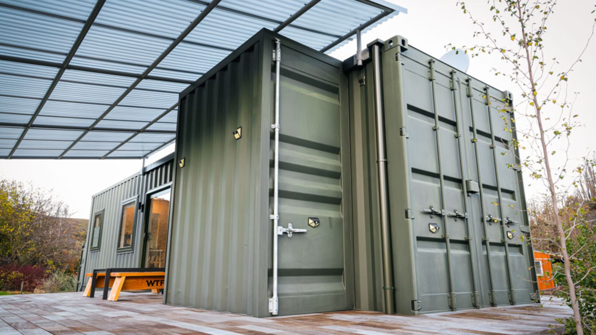 exterior of a container house surrounded by nature