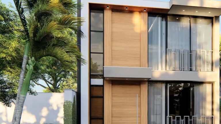 container home on two stories made with two 40-foot containers now with a modern facade in white and wood accents