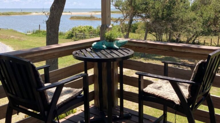 view from the balcony with a round table and two chairs