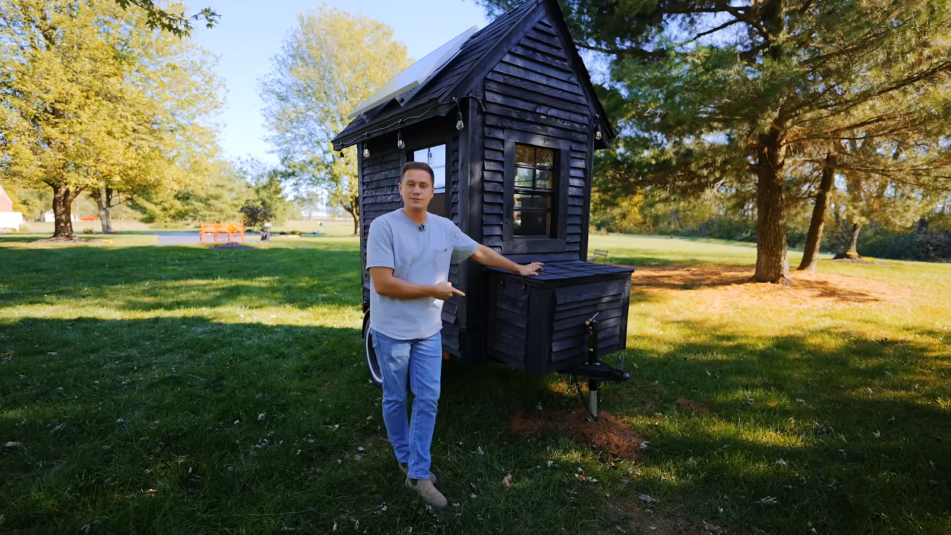 man showing off his tiny home