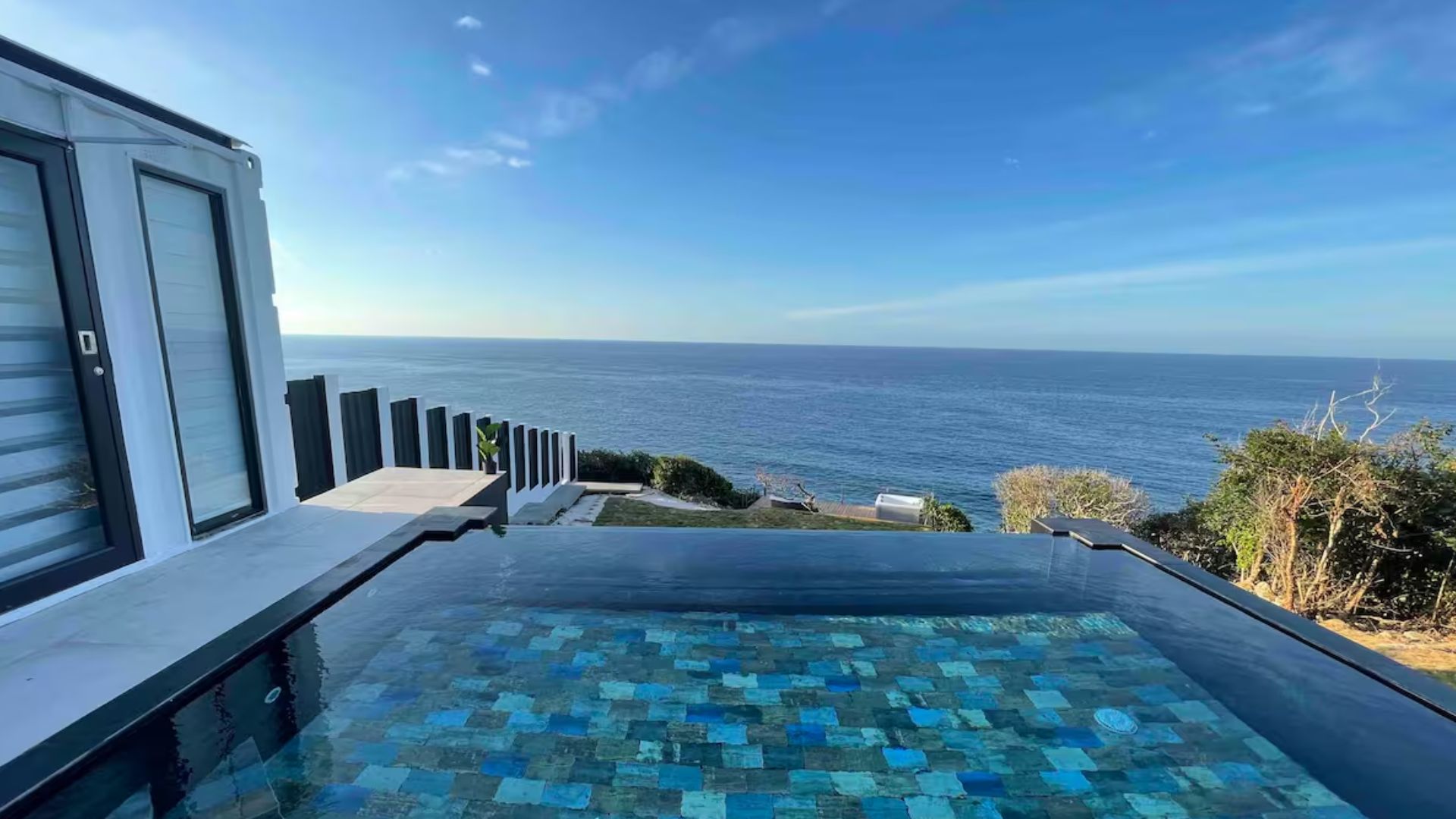 beautiful view from the terrace and the infinity pool by the container home