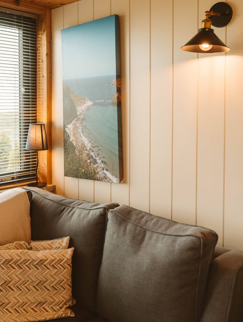 Tiny living room with art and light fixture