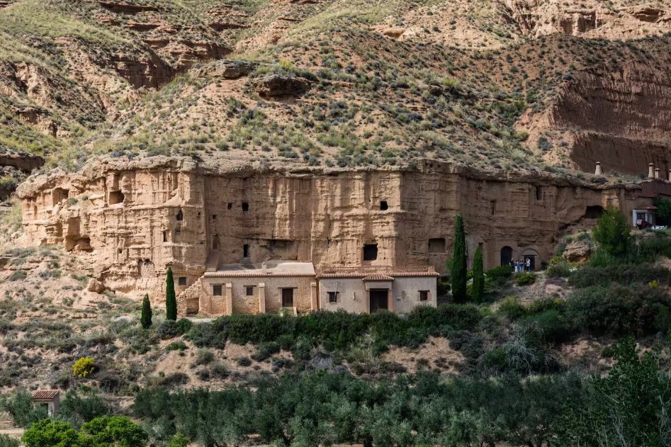 a house built within the rocks