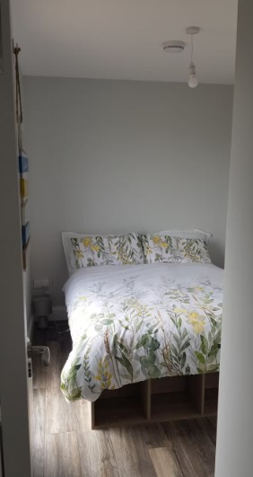 bedroom with a bed and floral bedsheets