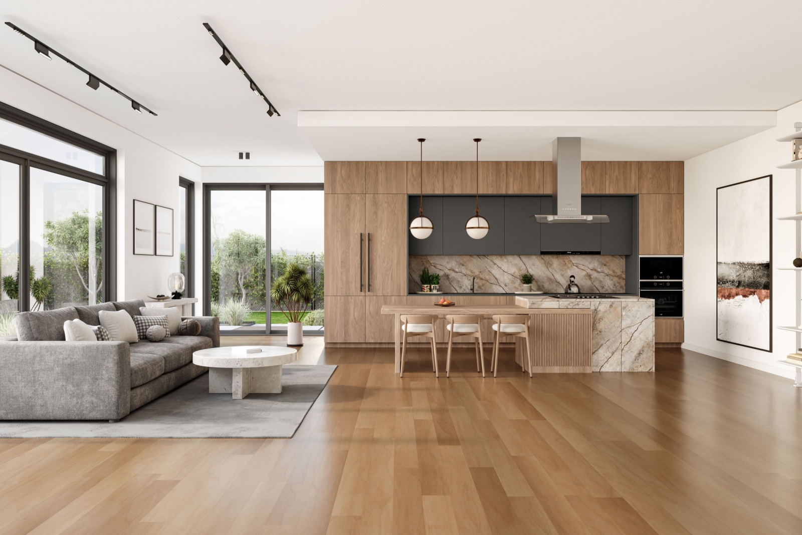 hardwood floors with the living room in the background on the left with a gray couch and a kitchen on the right with brown cabinets