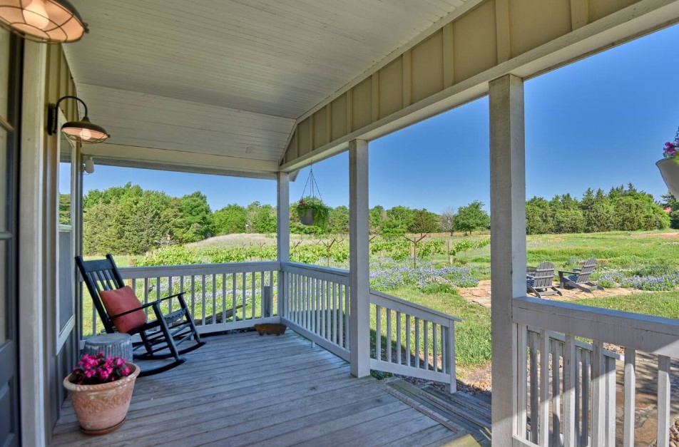 porch of a tiny home with a rocking chair in the corner