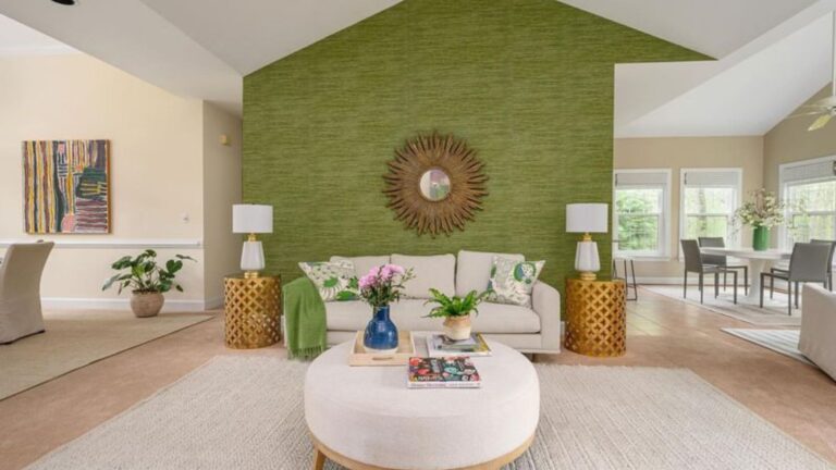 living room with a green accent wall