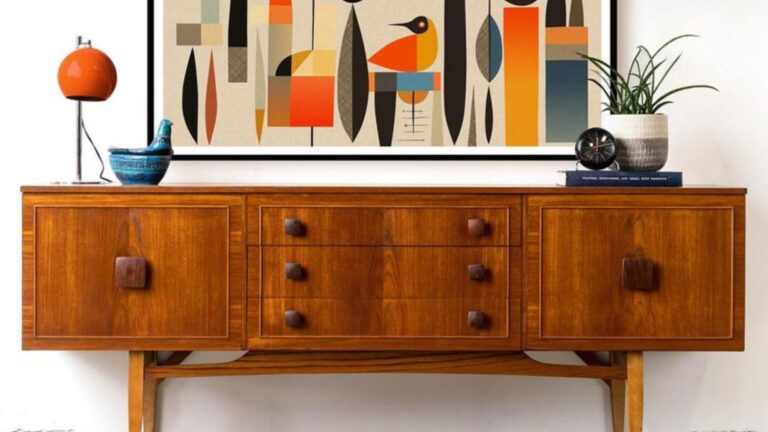 brown cabinet with an artwork above