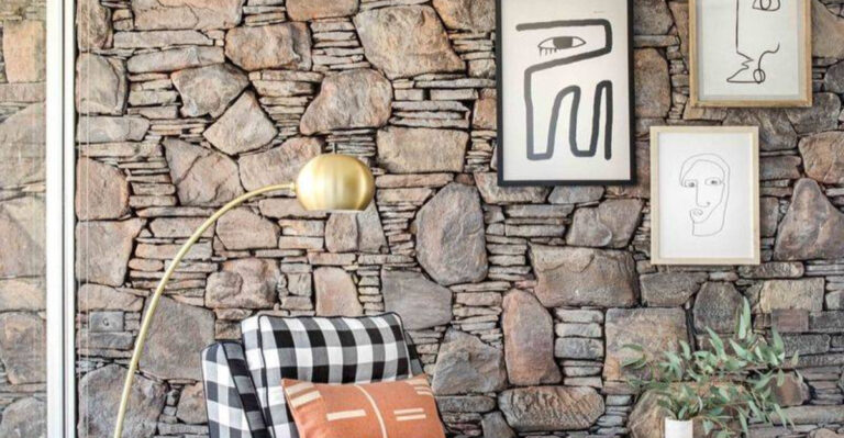stone living room wall with artprints