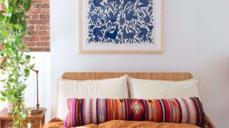 bedroom with a tapestry above the bed