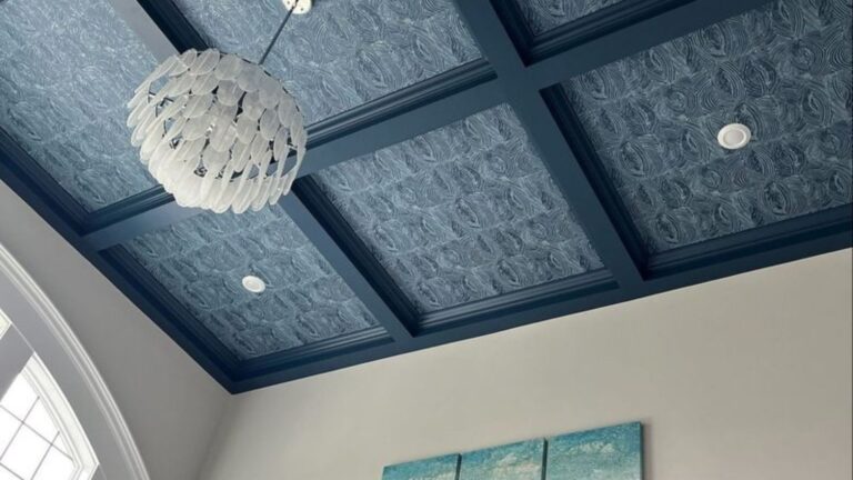 blue ceiling with a chandelier