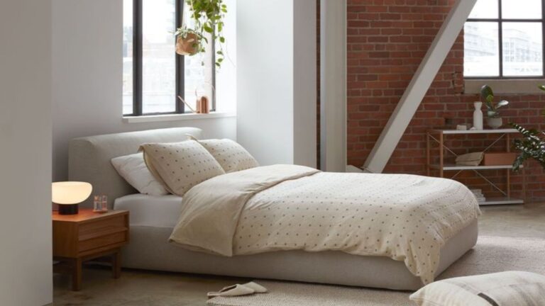 bedroom with a bed and a brown bedside table