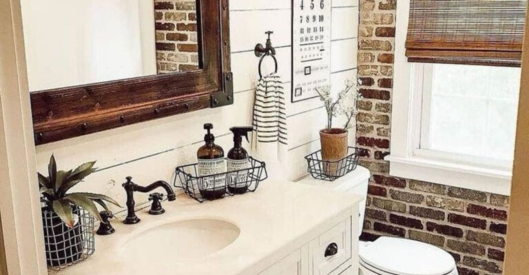 farmhouse bathroom with an exposed brick wall