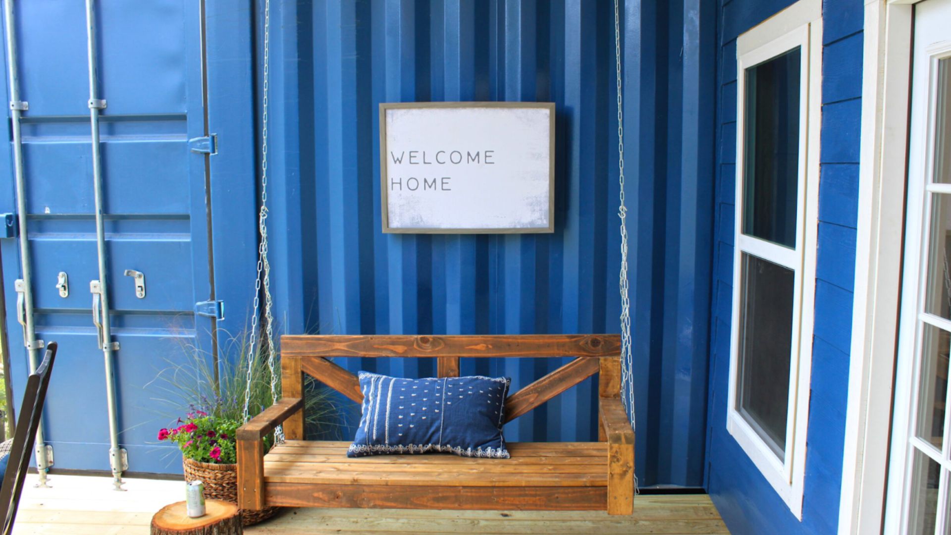 cobalt blue house wih a porch swing