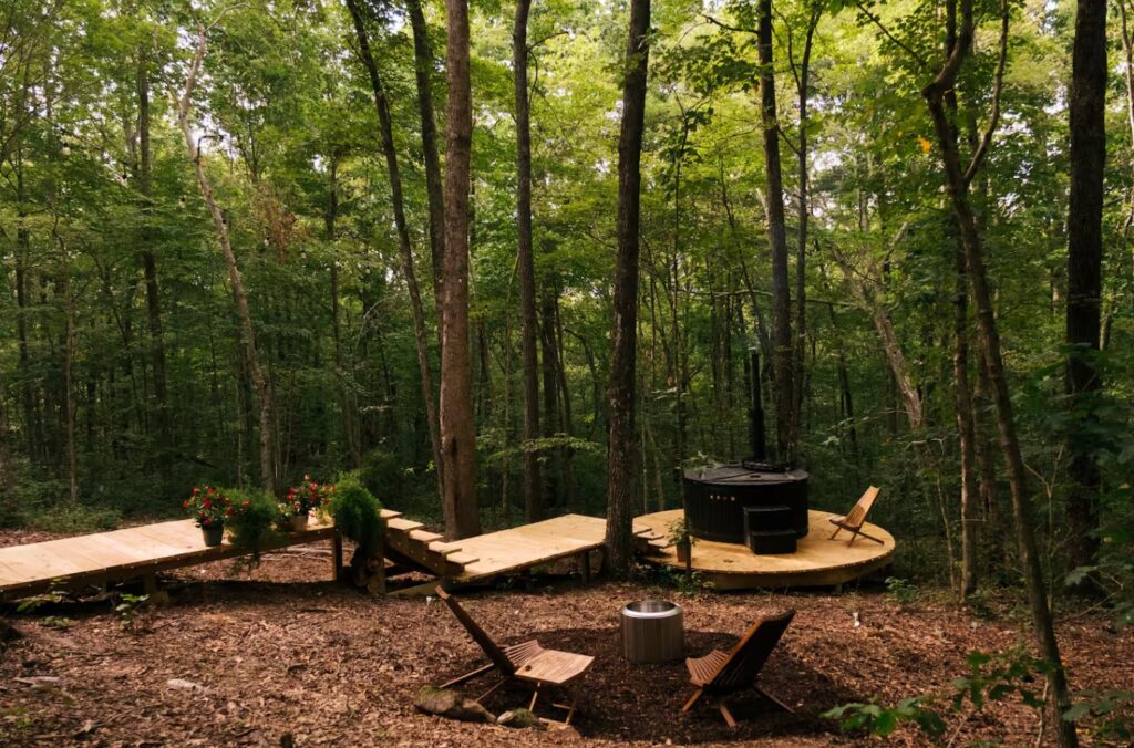 Deck with hot tub and fire pit in a forest