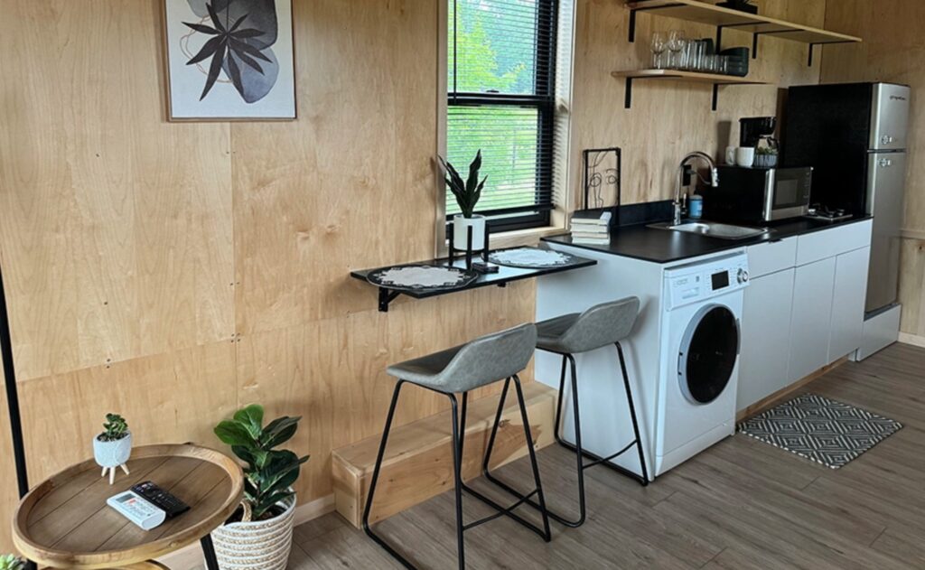 Dining nook with a desk mounted to a wall