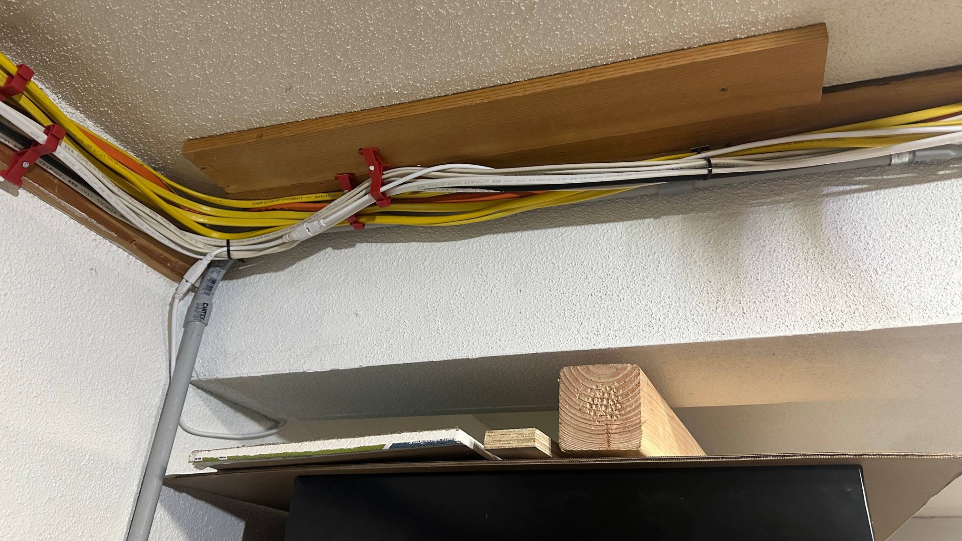 exposed wires hooked on the wall