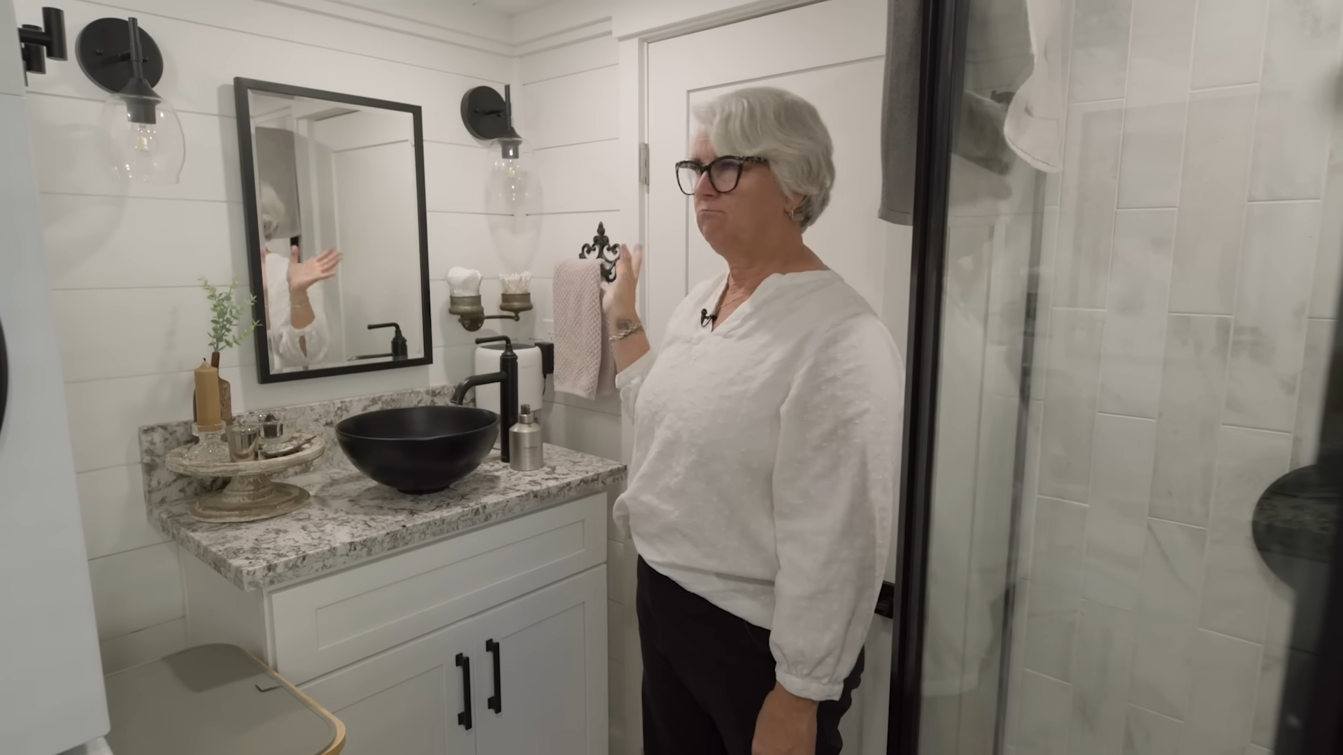 woman in her white bathroom