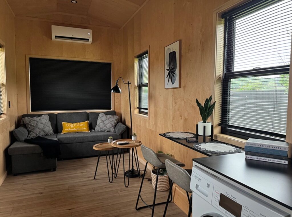 Living room with a gray couch and two coffee tables