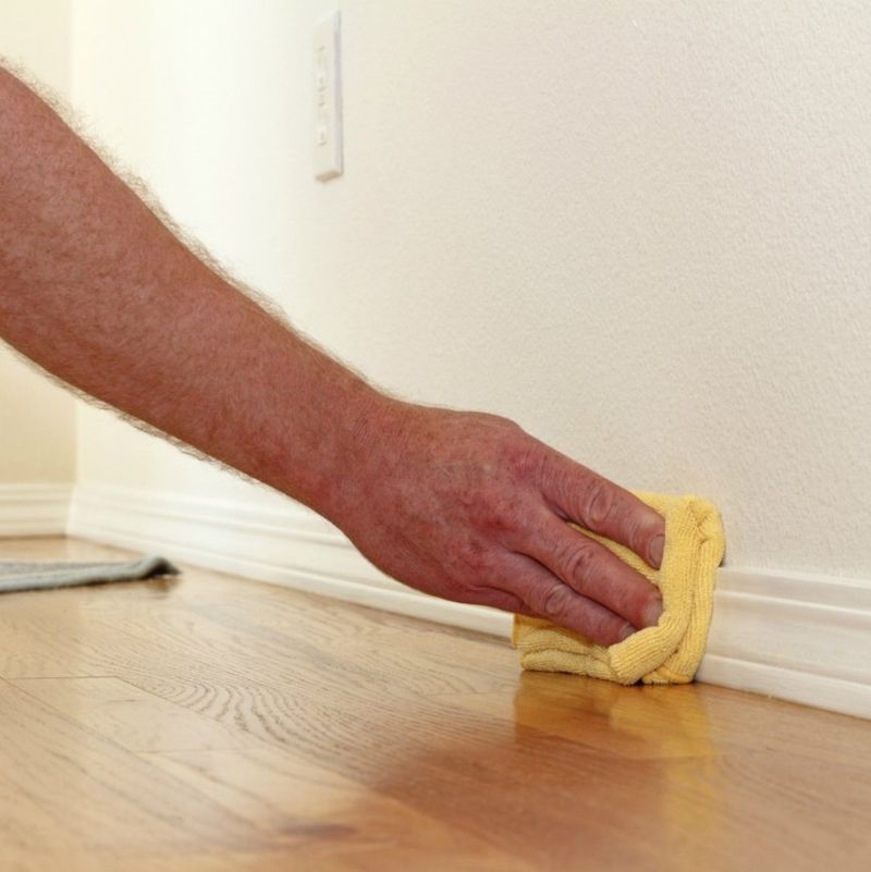 Wiping Baseboards