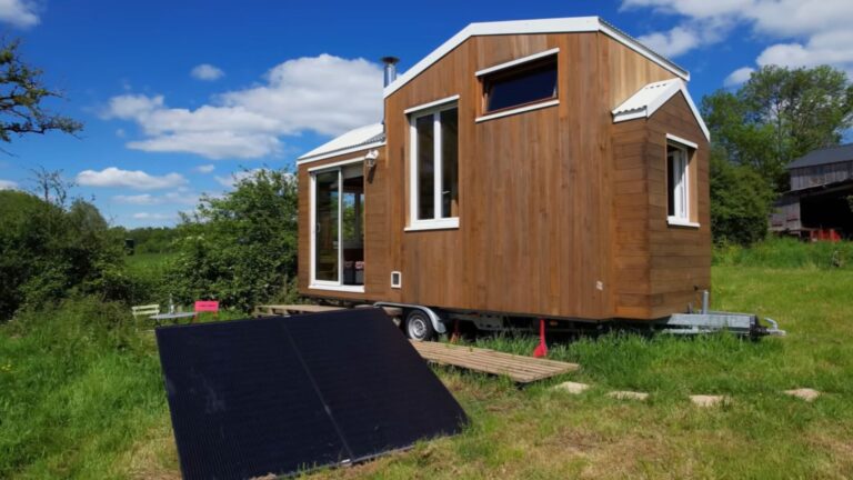 exterior of a tiny home on wheels with wooden walls