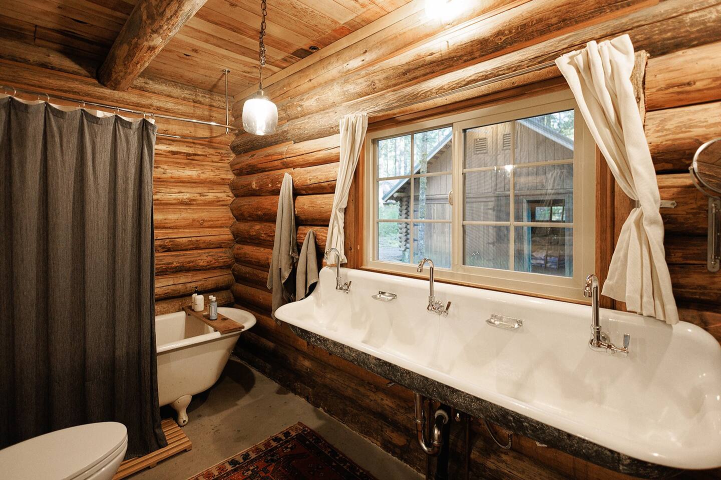 bathroom with a wide white sink, white bathtub