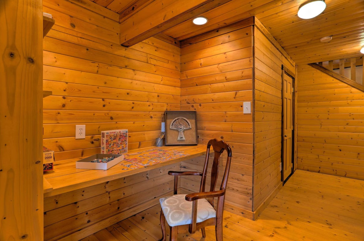 office area with a brown desk, brown chair and brown walls